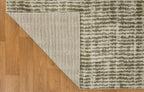 Neutral textured area rug with vertical striped pattern in beige and green tones