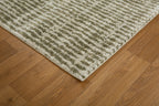 Neutral textured area rug with vertical striped pattern in beige and green tones
