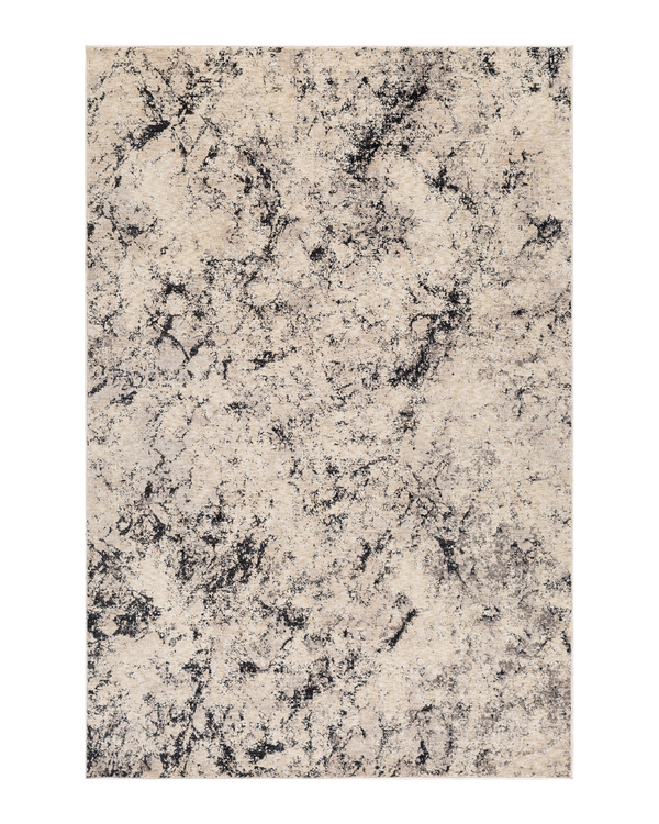 Modern distressed rug with black speckled pattern on cream background texture