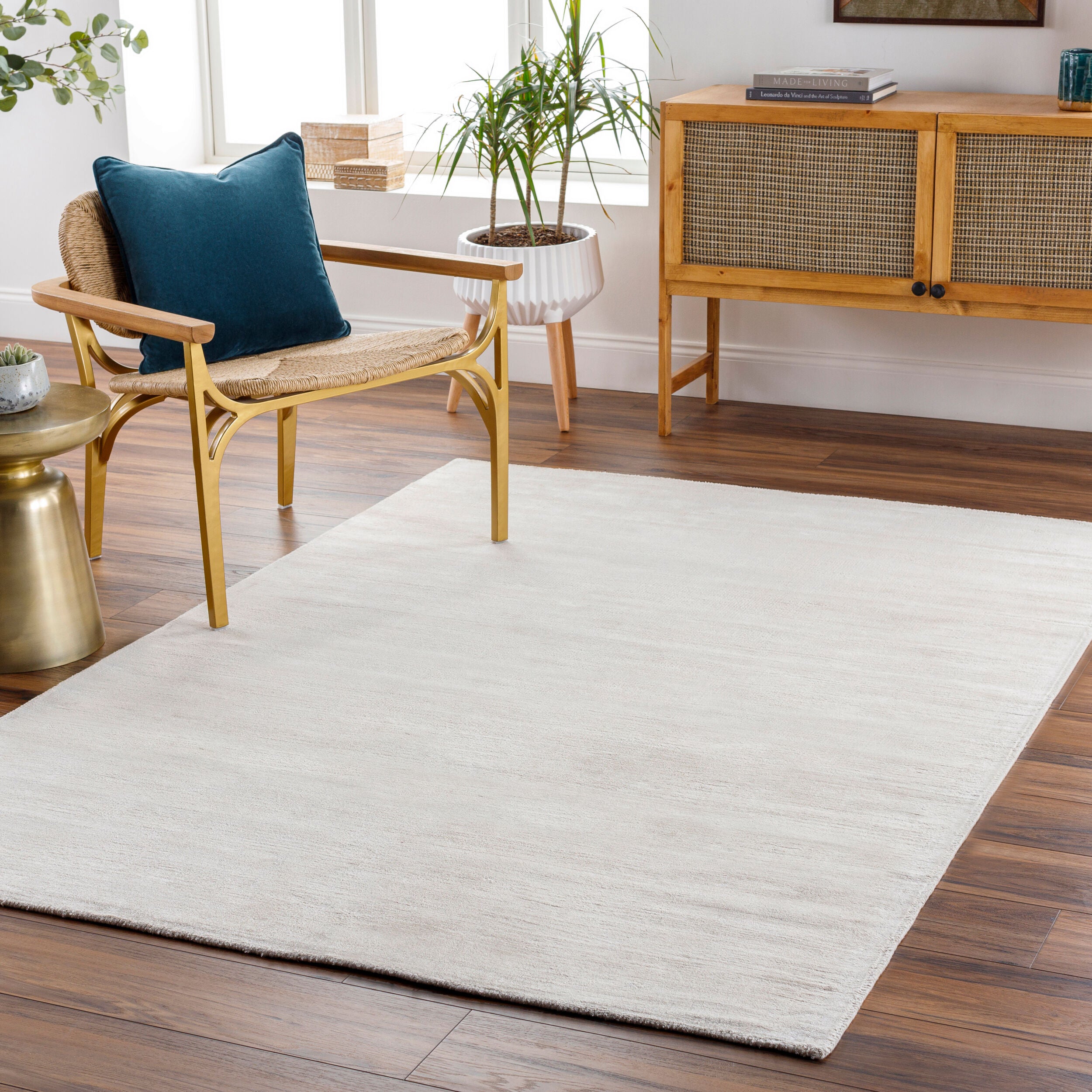 Soft beige wool rug with subtle woven texture and natural fibers
