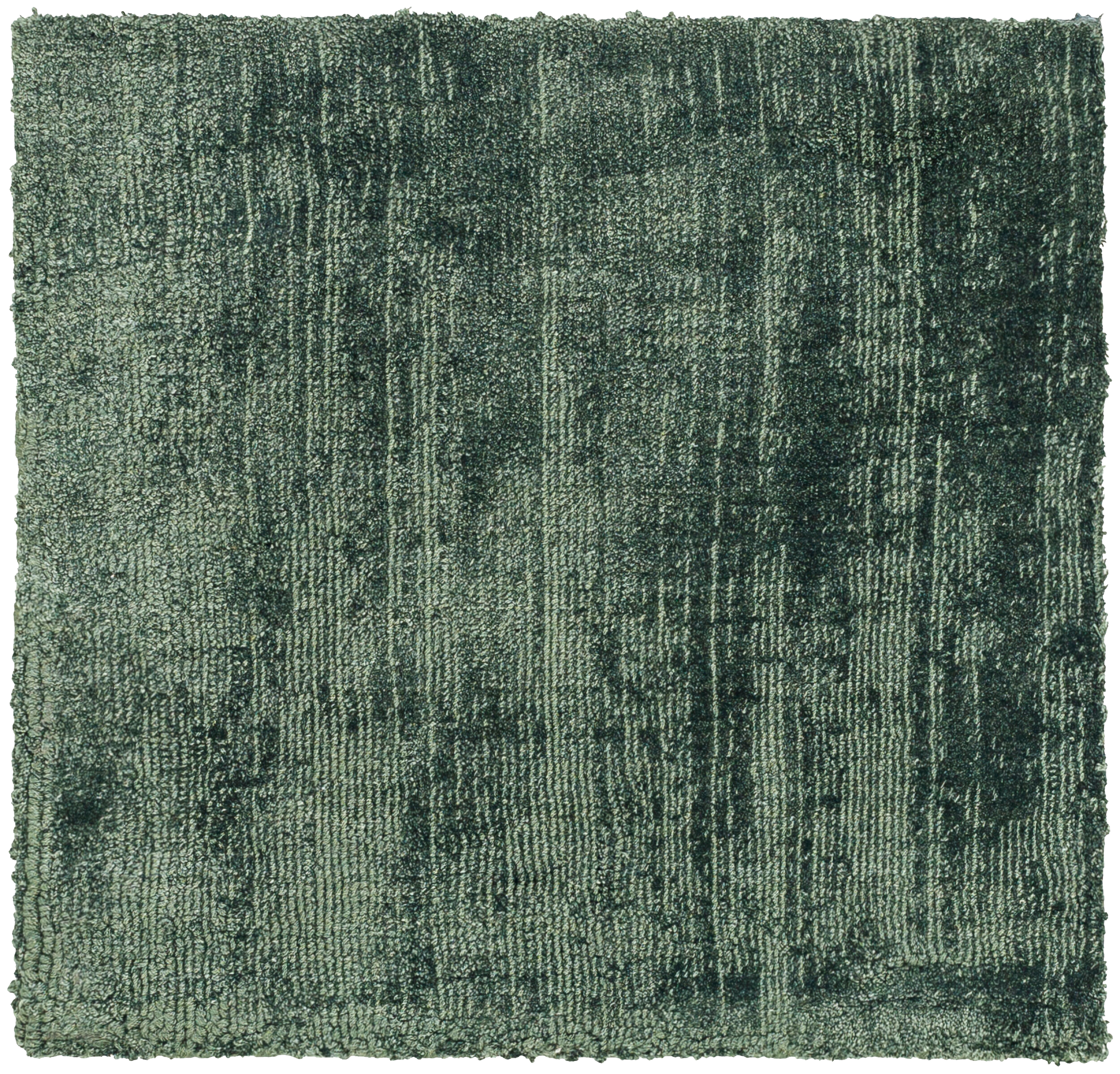 Sage green distressed rug with textured, mottled surface and worn vintage appearance