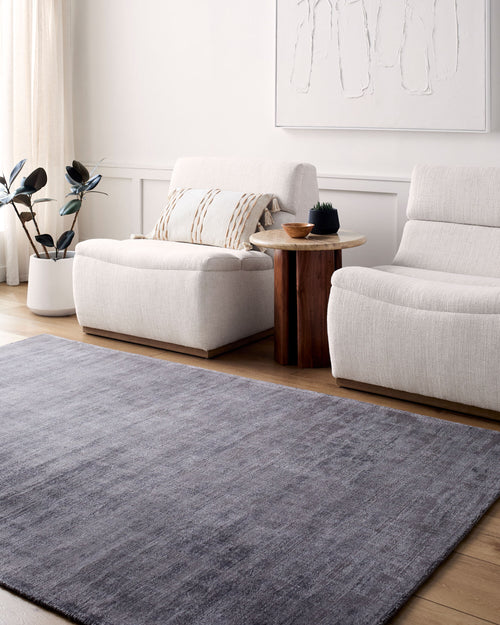 Grey distressed texture rug with subtle worn pattern and matte finish