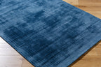 Blue distressed vintage style rug with textured woven pattern throughout