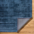 Blue distressed vintage style rug with textured woven pattern throughout