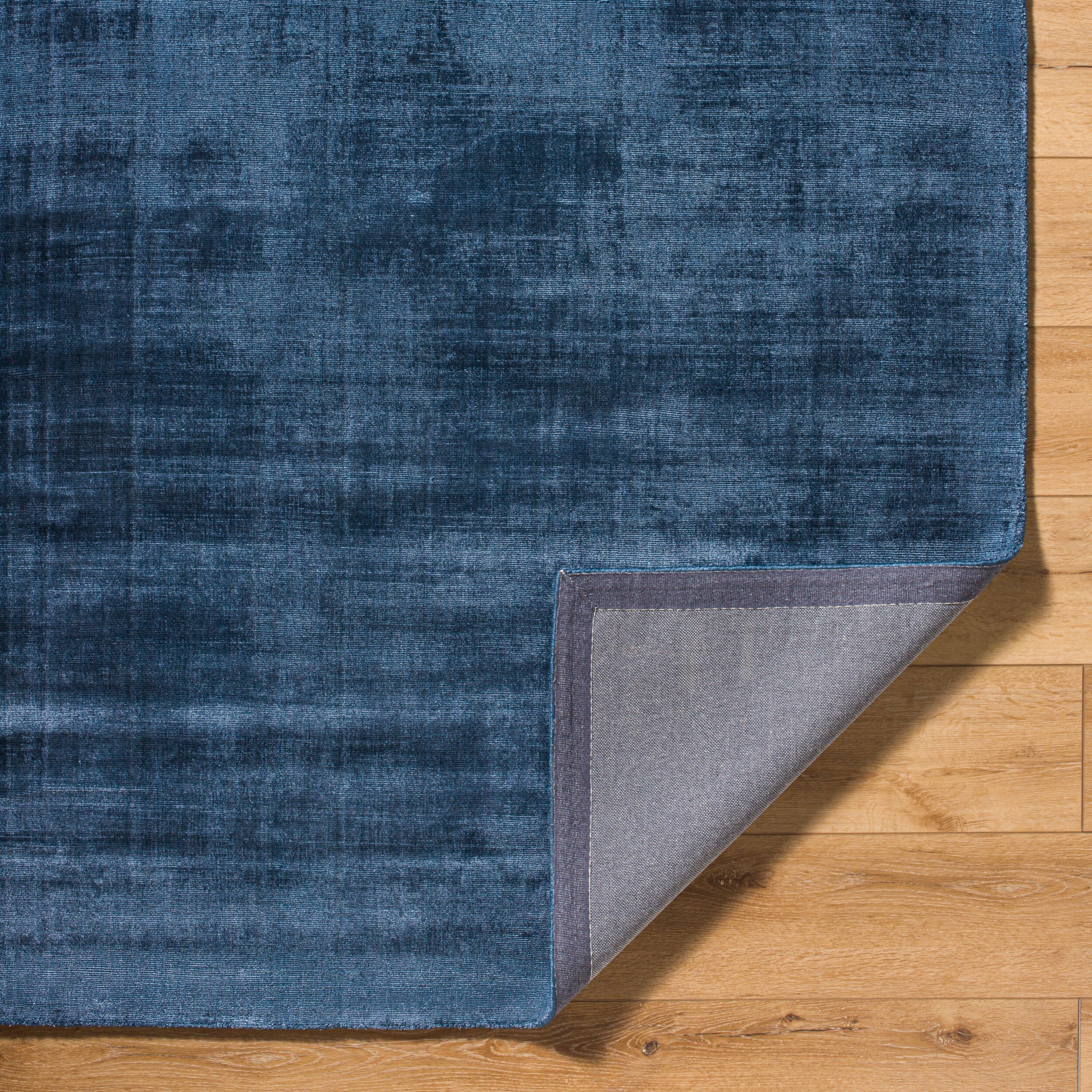 Blue distressed vintage style rug with textured woven pattern throughout