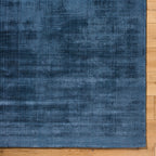 Blue distressed vintage style rug with textured woven pattern throughout