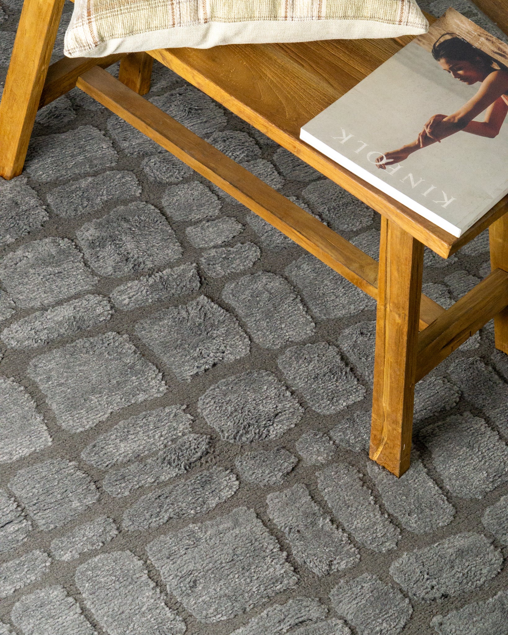 Grey crocodile textured area rug with geometric pattern in neutral tones