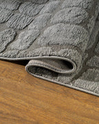 Grey crocodile textured area rug with geometric pattern in neutral tones