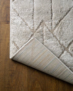 Geometric beige rug with tan diamond and chevron pattern design