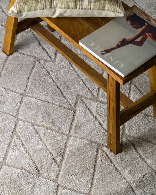 Geometric beige rug with tan diamond and chevron pattern design