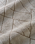 Geometric beige rug with tan diamond and chevron pattern design