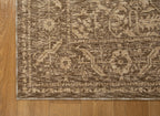 Taupe geometric damask patterned rug with textured woven appearance