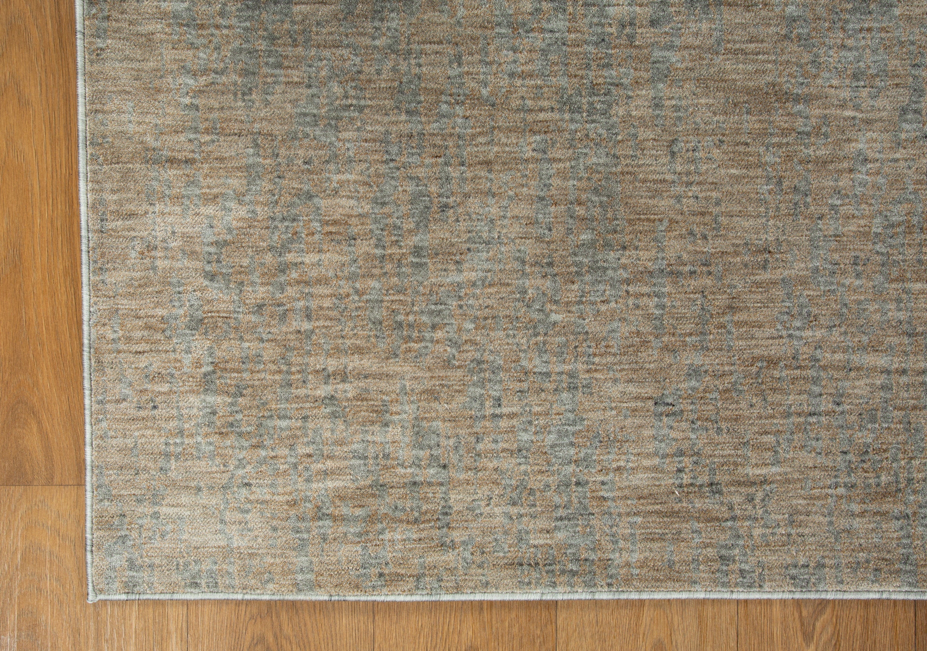 Neutral beige wool rug with subtle textured weave pattern throughout