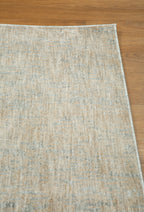 Neutral beige wool rug with subtle textured weave pattern throughout