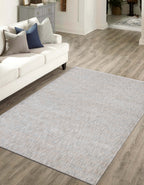 Neutral beige wool rug with subtle textured weave pattern throughout