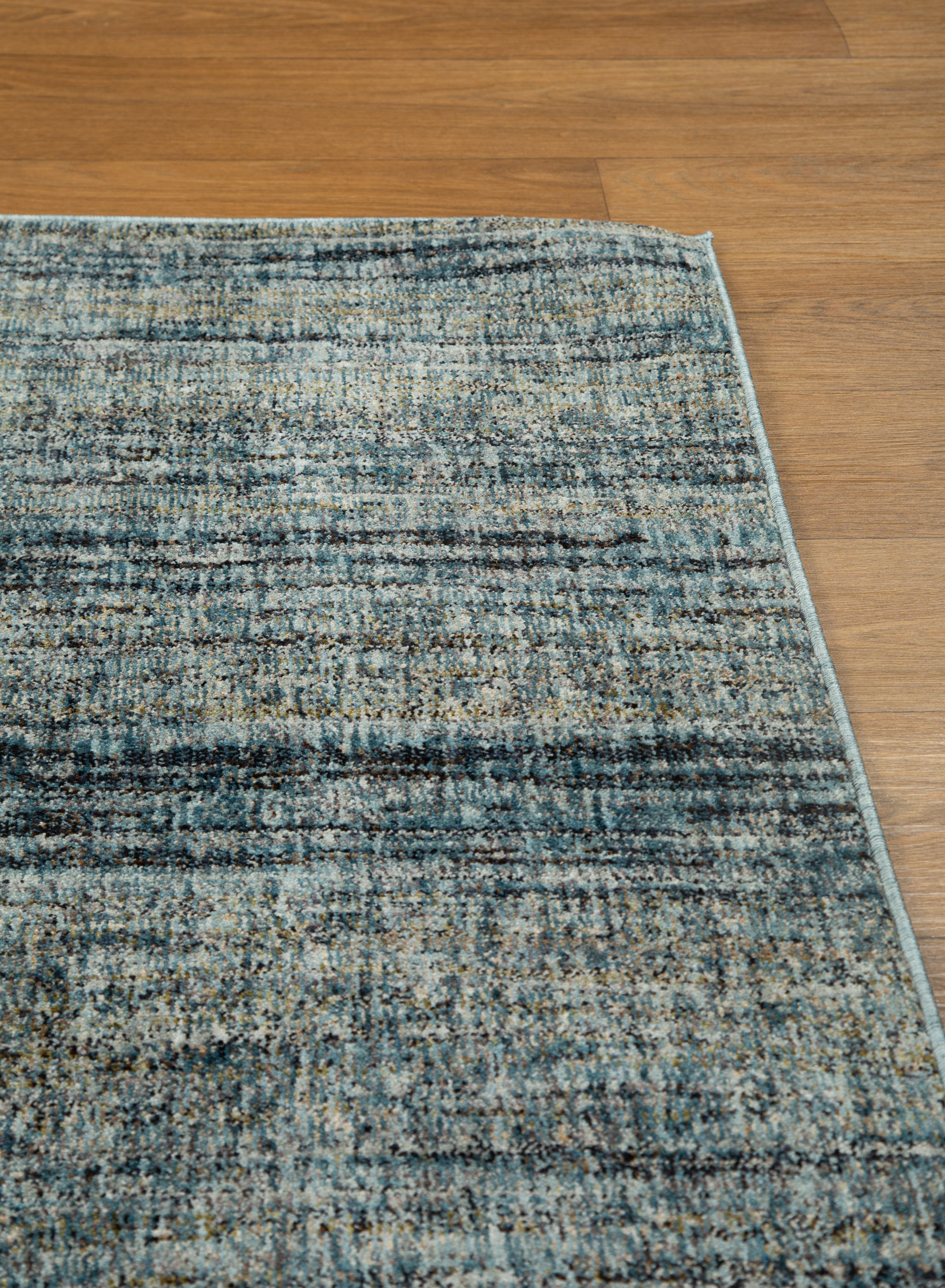 Grey and blue textured area rug with horizontal striped pattern