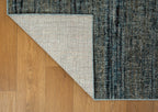 Grey and blue textured area rug with horizontal striped pattern