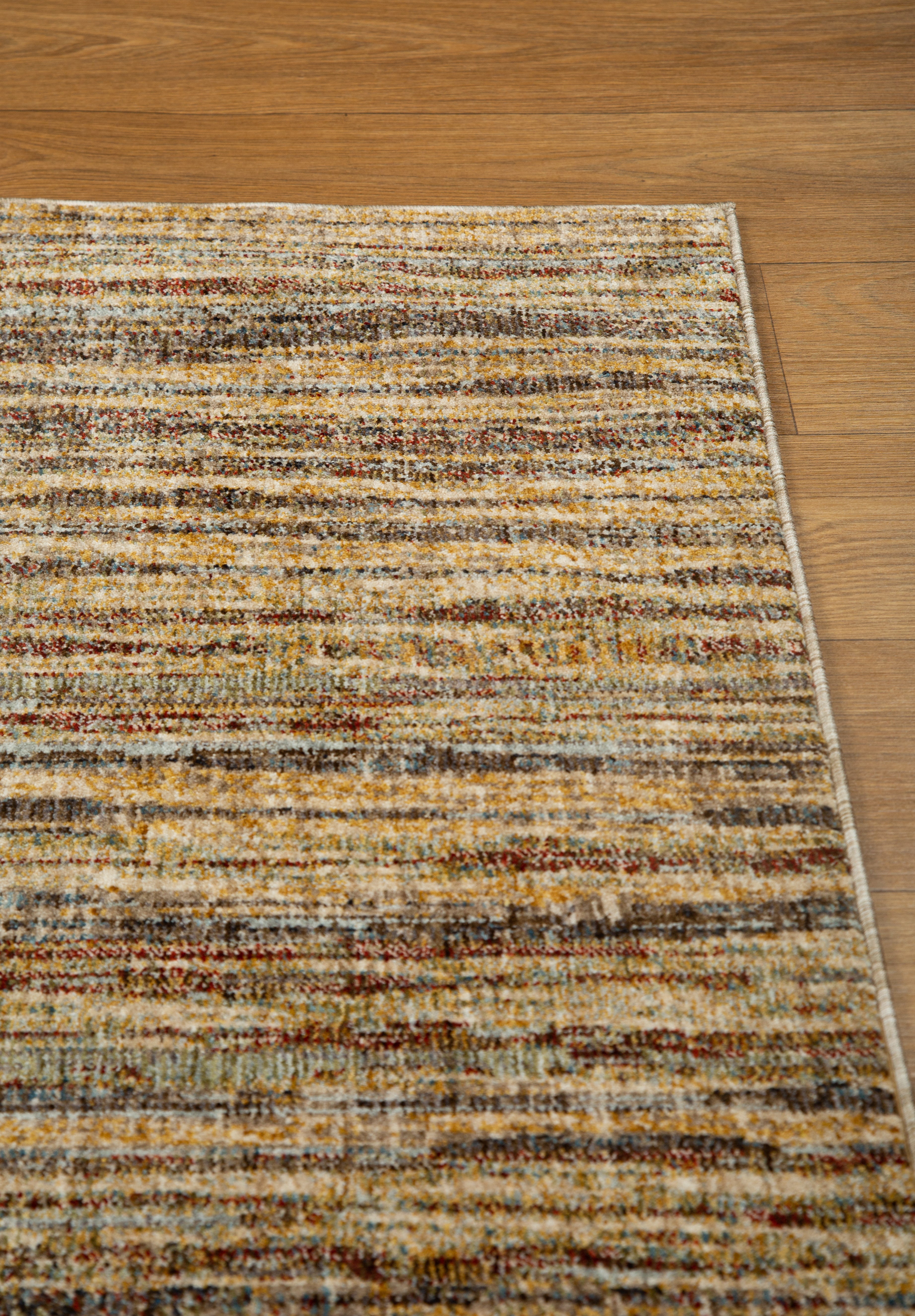 Brown textured area rug with horizontal woven pattern in natural tones