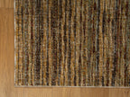 Brown textured area rug with horizontal woven pattern in natural tones