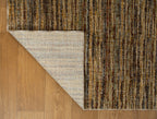 Brown textured area rug with horizontal woven pattern in natural tones