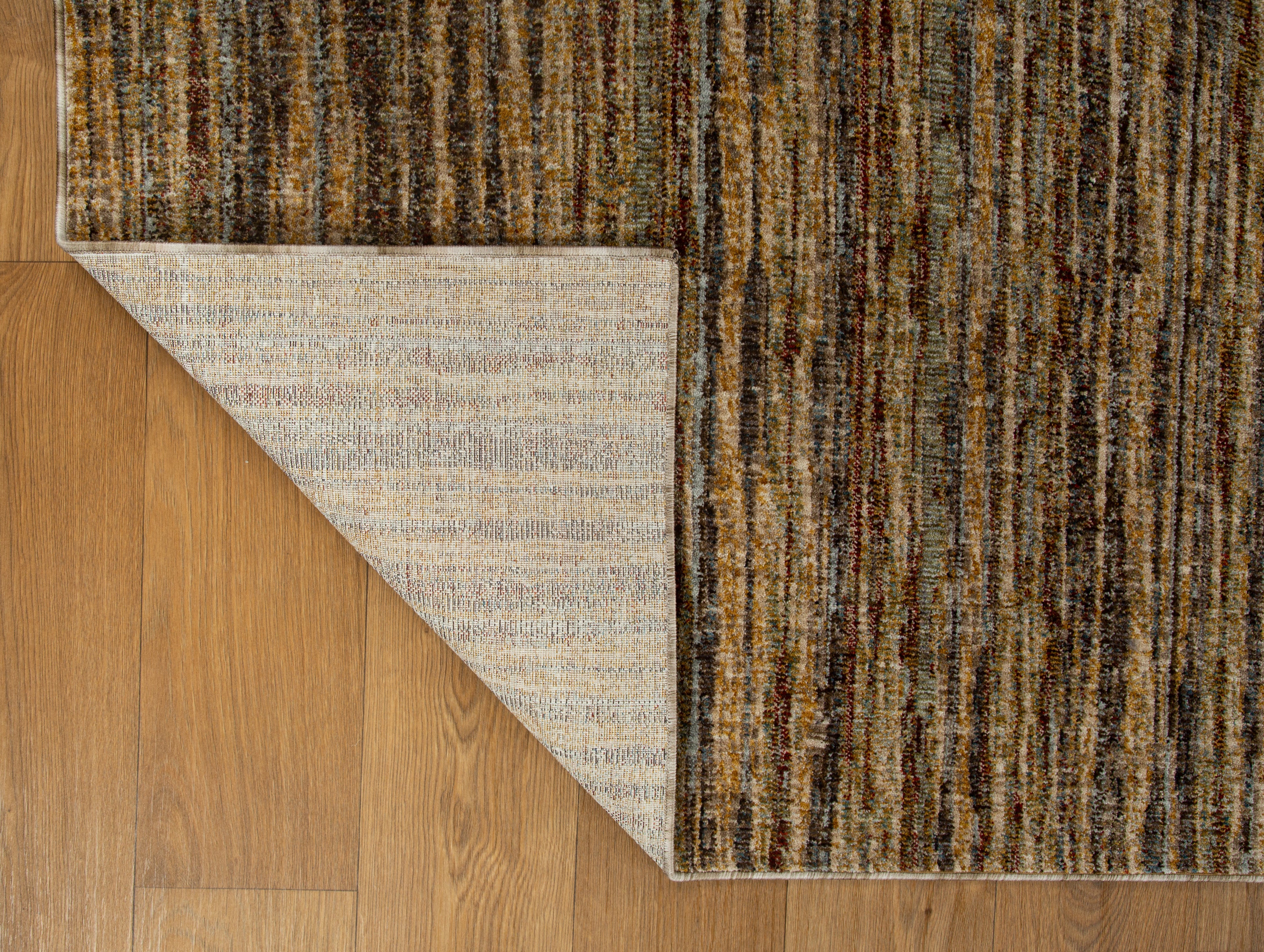 Brown textured area rug with horizontal woven pattern in natural tones