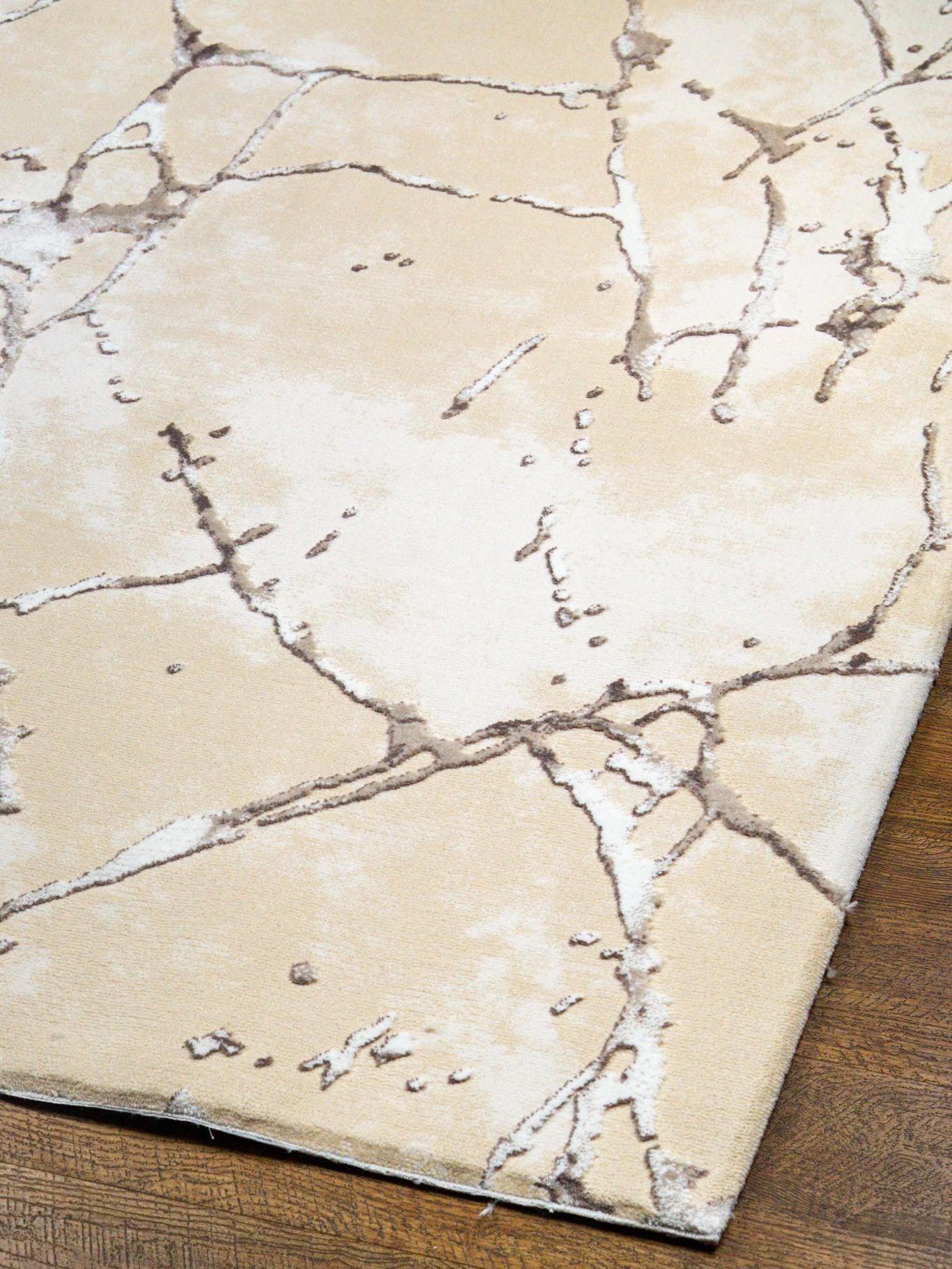 Beige crackle pattern rug with abstract veining and neutral earth tones