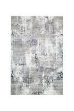 Distressed grey and white abstract area rug with weathered texture pattern