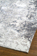 Modern abstract grey and white distressed texture area rug with mottled pattern