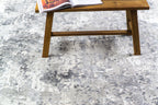 Modern abstract grey and white distressed texture area rug with mottled pattern