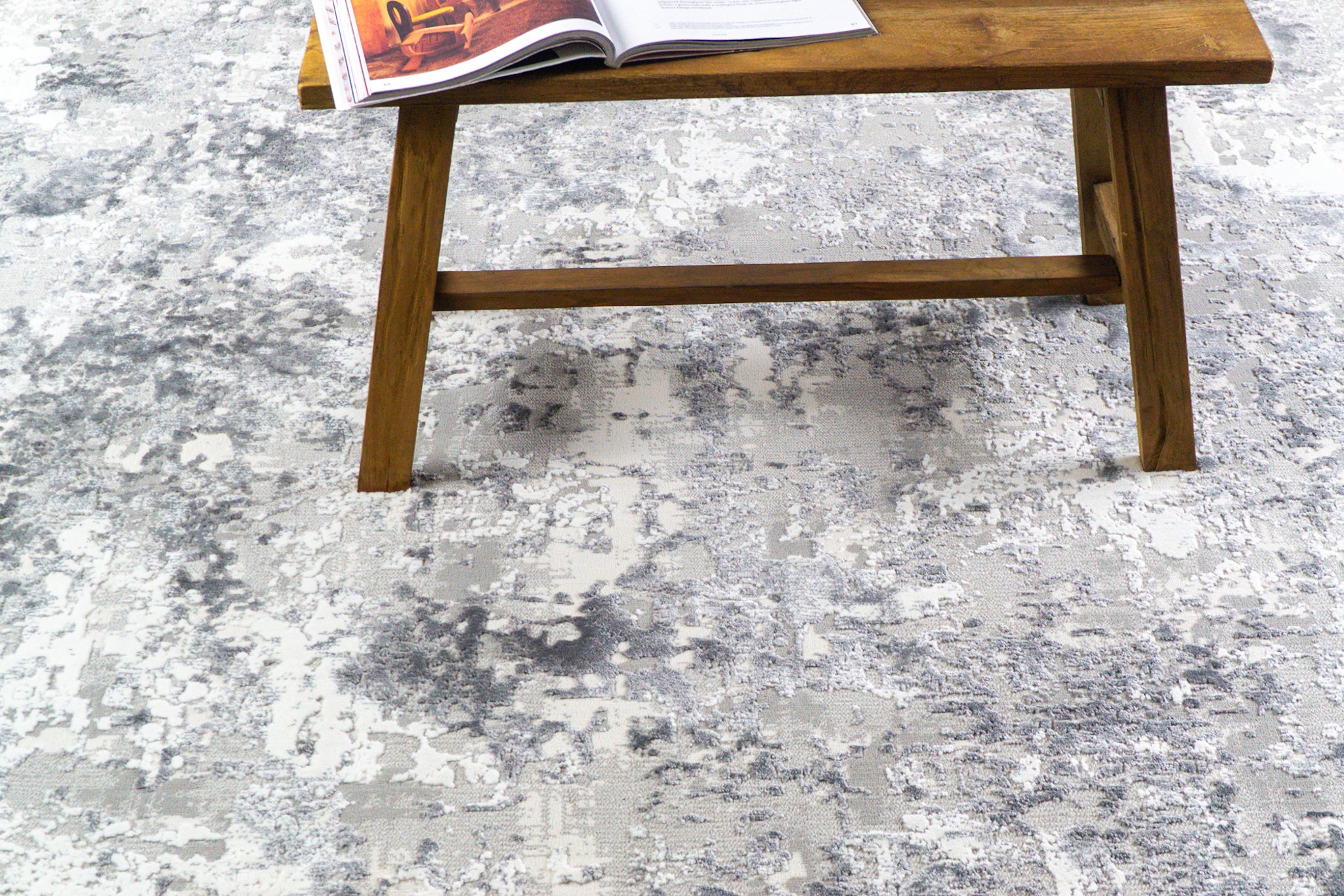 Modern abstract grey and white distressed texture area rug with mottled pattern