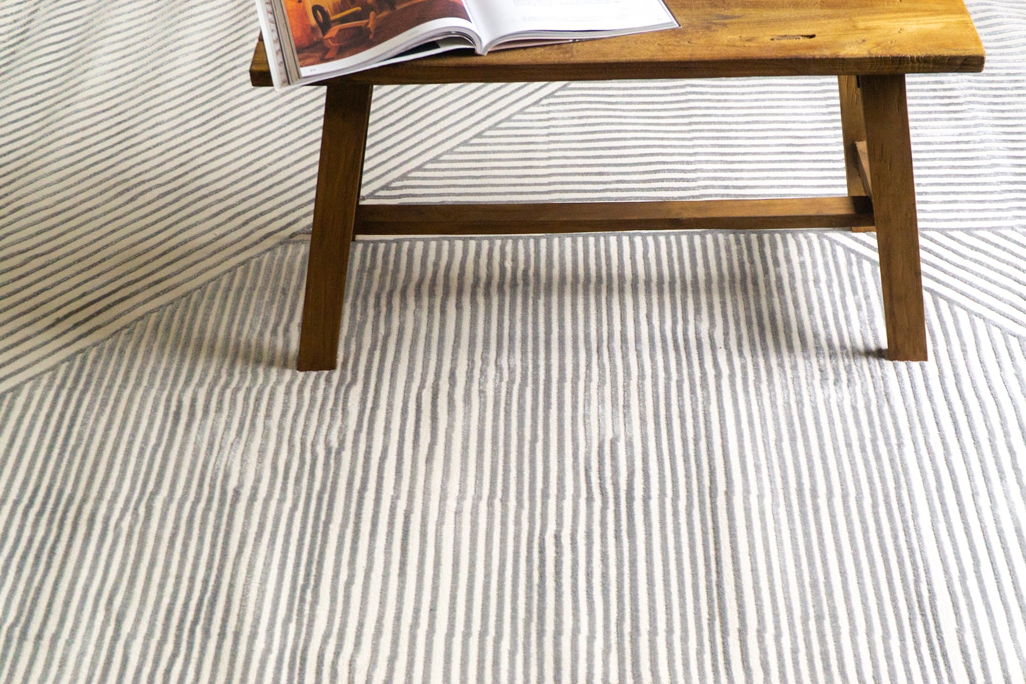 Modern geometric rug with grey and white striped pattern in contemporary design