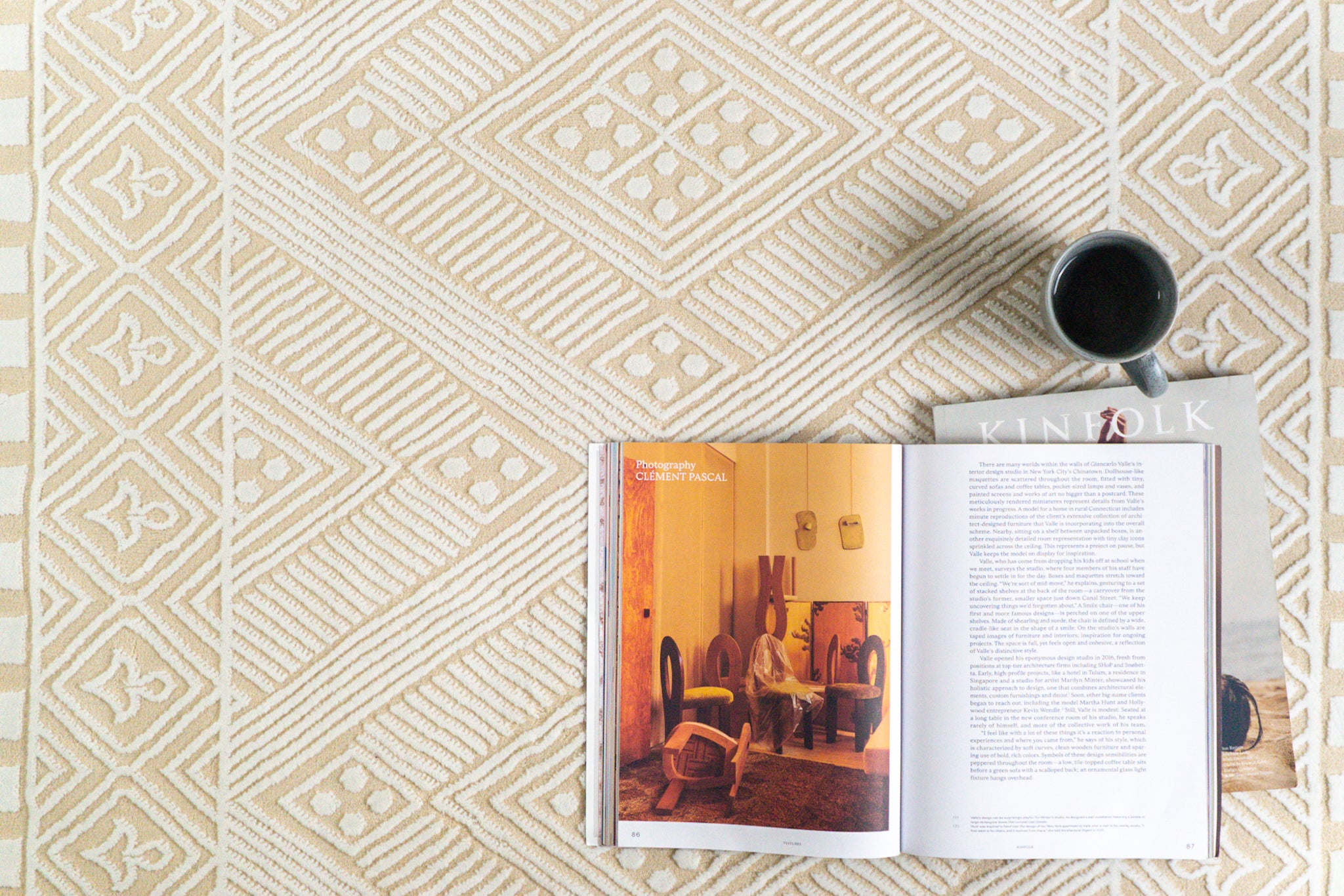 Geometric patterned rug in beige and cream with tribal diamond motifs