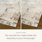Distressed beige and gray textured rug with mottled vintage pattern