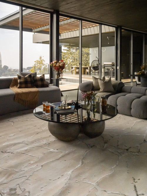 Beige crackle pattern rug with abstract veining and neutral earth tones