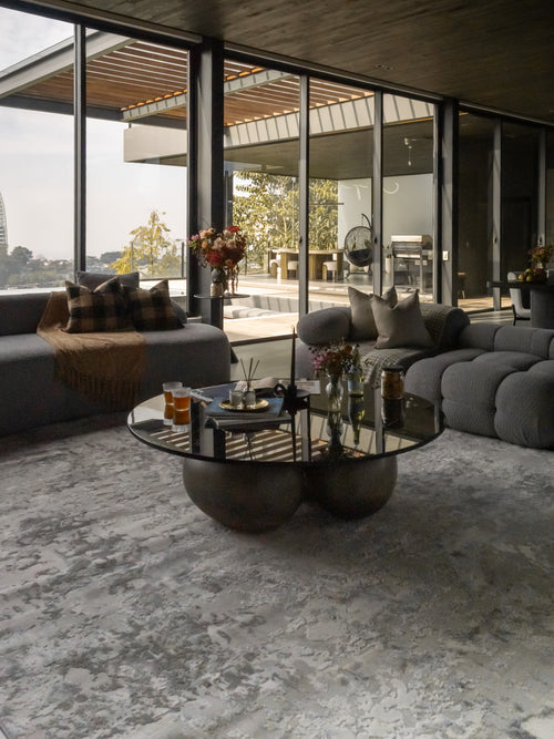 Modern abstract grey and white distressed texture area rug with mottled pattern