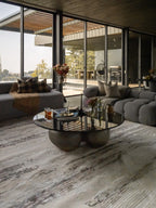 Distressed cream and brown striped area rug with weathered texture
