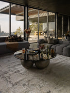 Distressed beige and gray textured rug with mottled vintage pattern