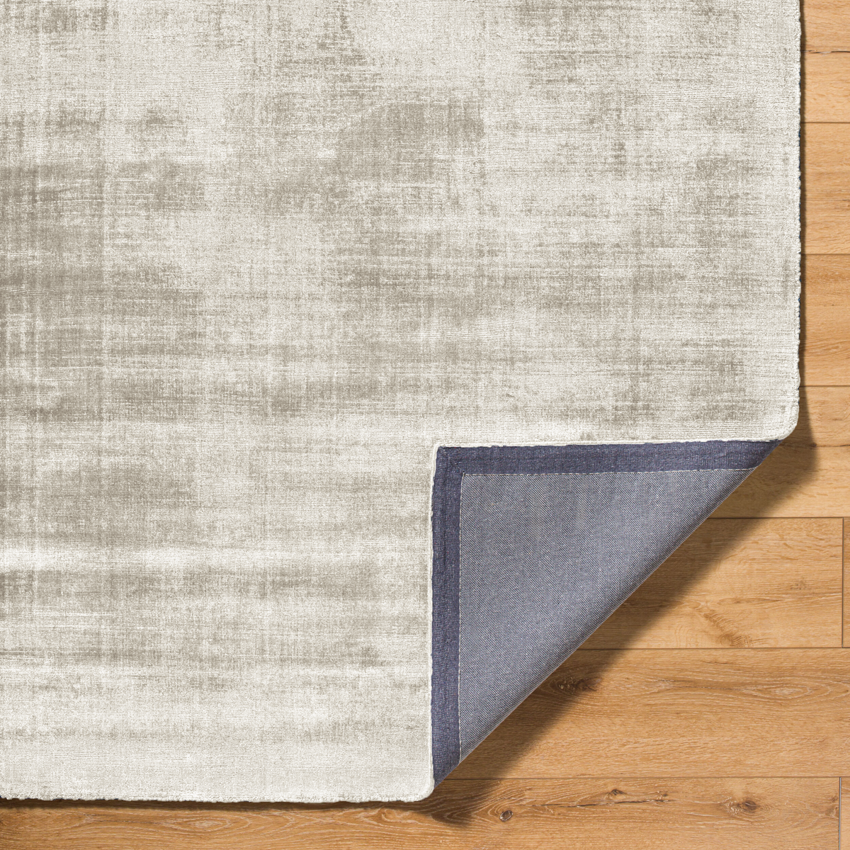 Amara viscose hand-loomed area rug in Ivory White, backing view
