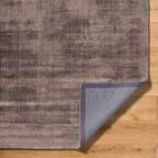 Modern distressed mauve rug with abstract worn texture pattern