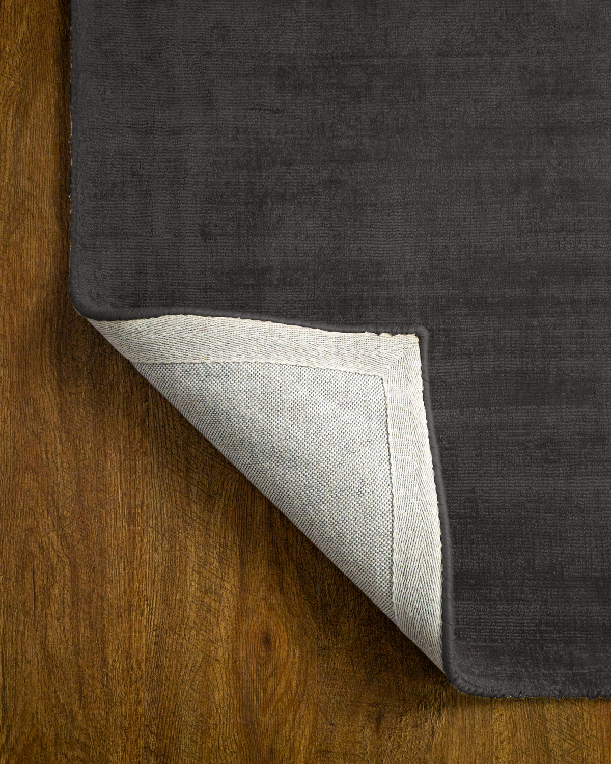 Amara viscose hand-loomed area rug in Black, backing view