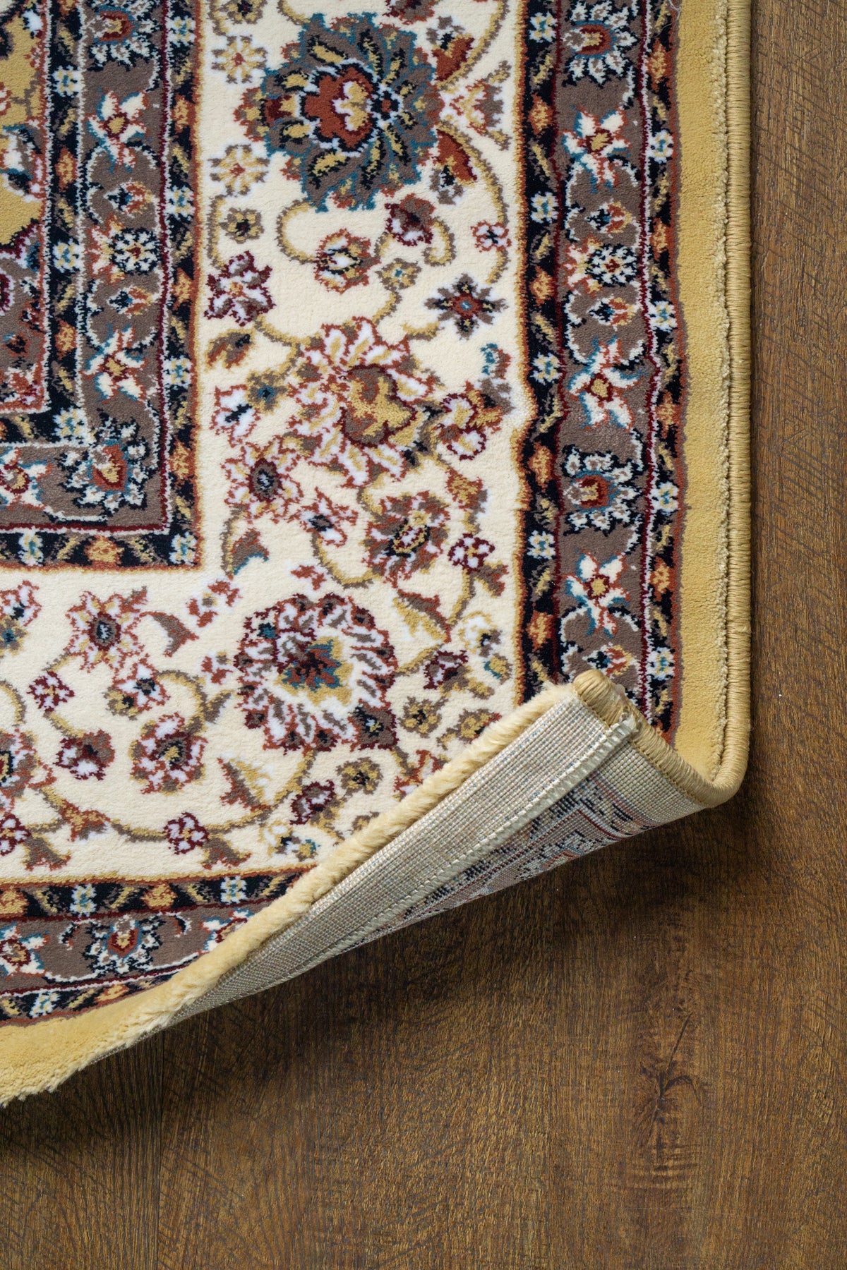 Traditional Persian rug with gold center, cream border and ornate floral medallion pattern