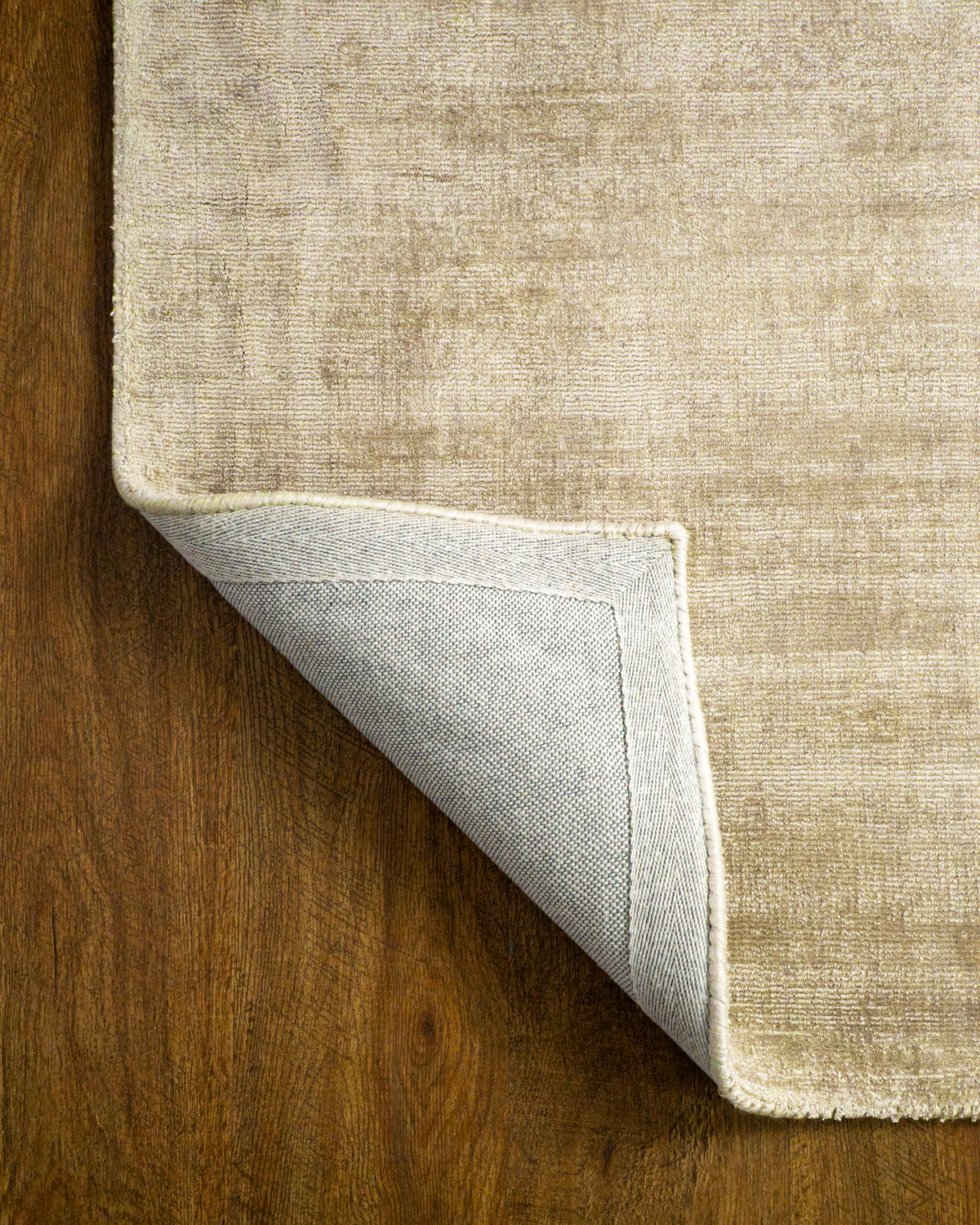 Amara viscose hand-loomed area rug in Shell Beige, backing view
