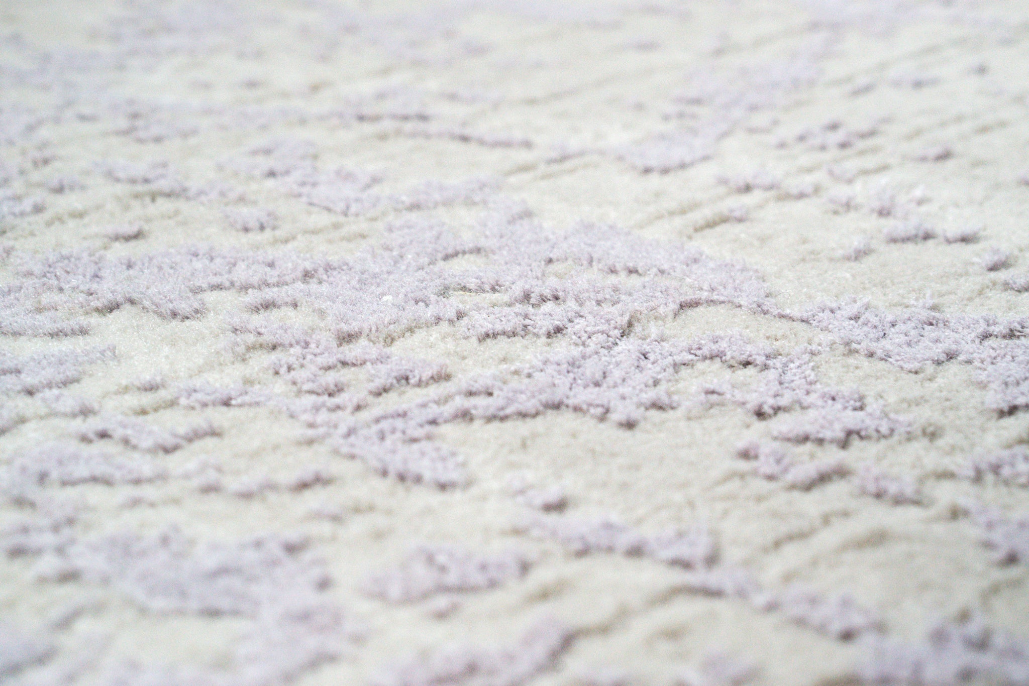 Distressed grey and lavender rug with mottled vintage texture