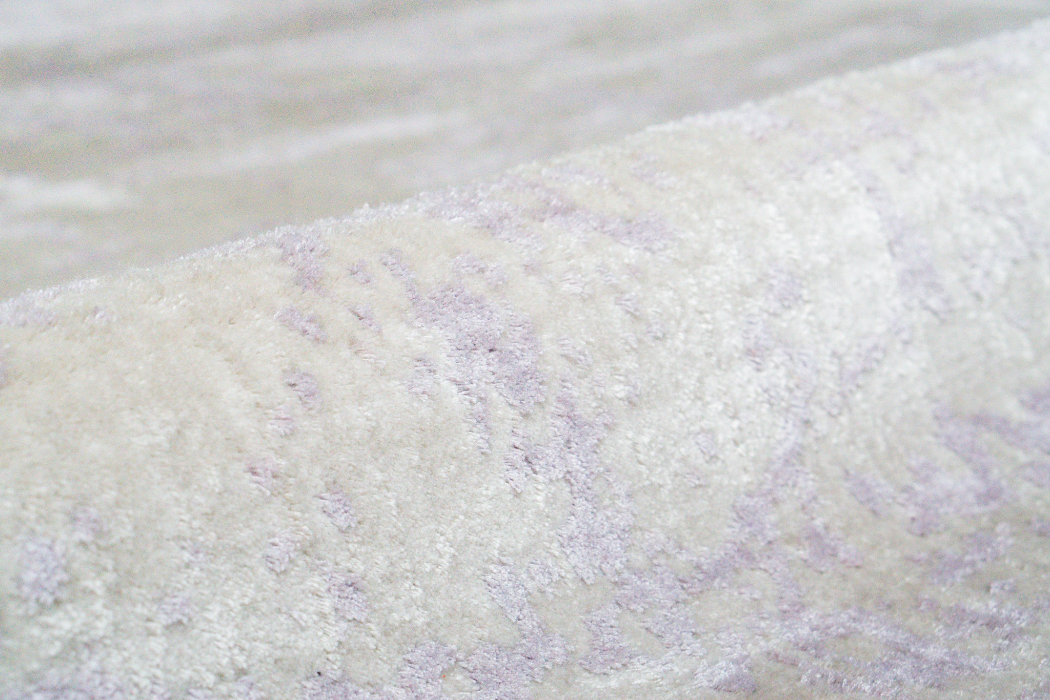 Distressed grey and lavender rug with mottled vintage texture
