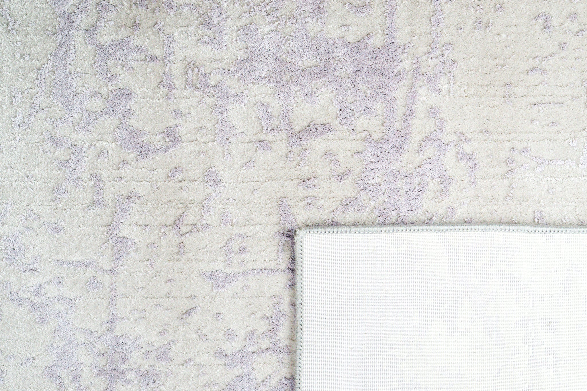 Distressed grey and lavender rug with mottled vintage texture
