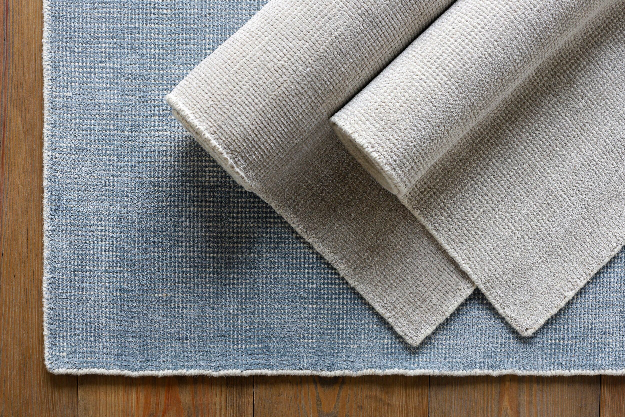 Cream textured wool area rug with natural woven pattern and soft neutral tone
