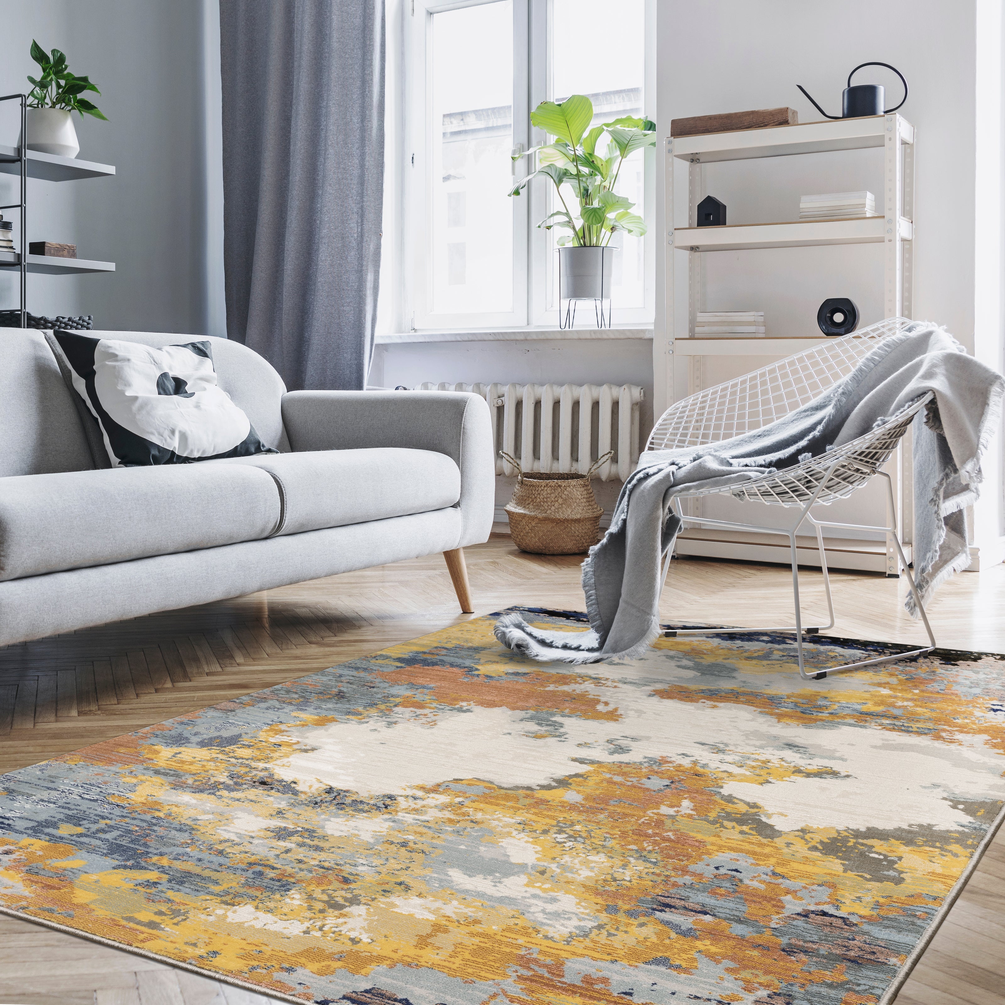 Abstract distressed rug with yellow, blue, and cream paint splatter pattern design