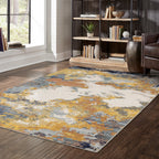 Abstract distressed rug with yellow, blue, and cream paint splatter pattern design