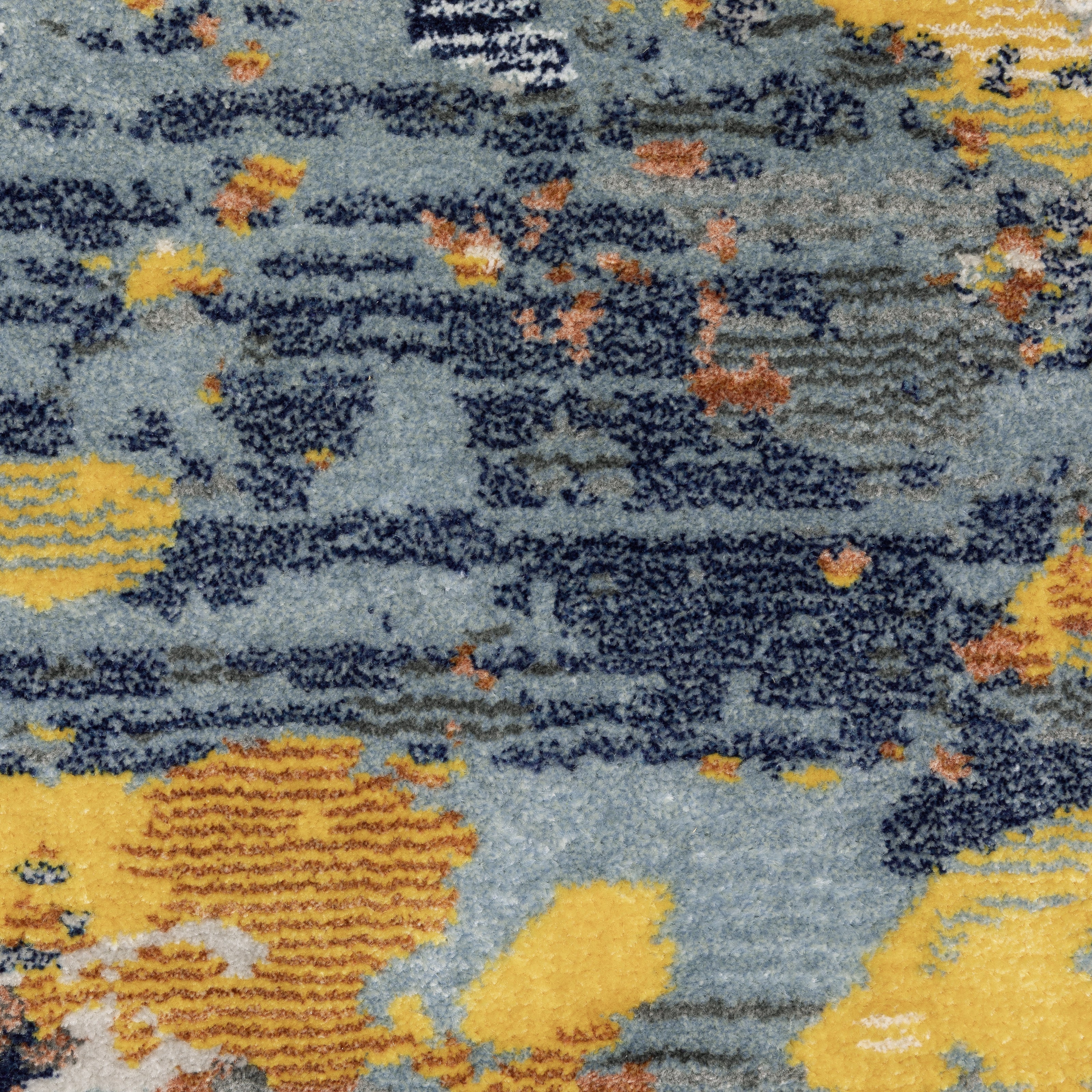 Abstract distressed rug with yellow, blue, and cream paint splatter pattern design