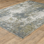 Modern distressed area rug with grey, cream, and olive abstract texture pattern